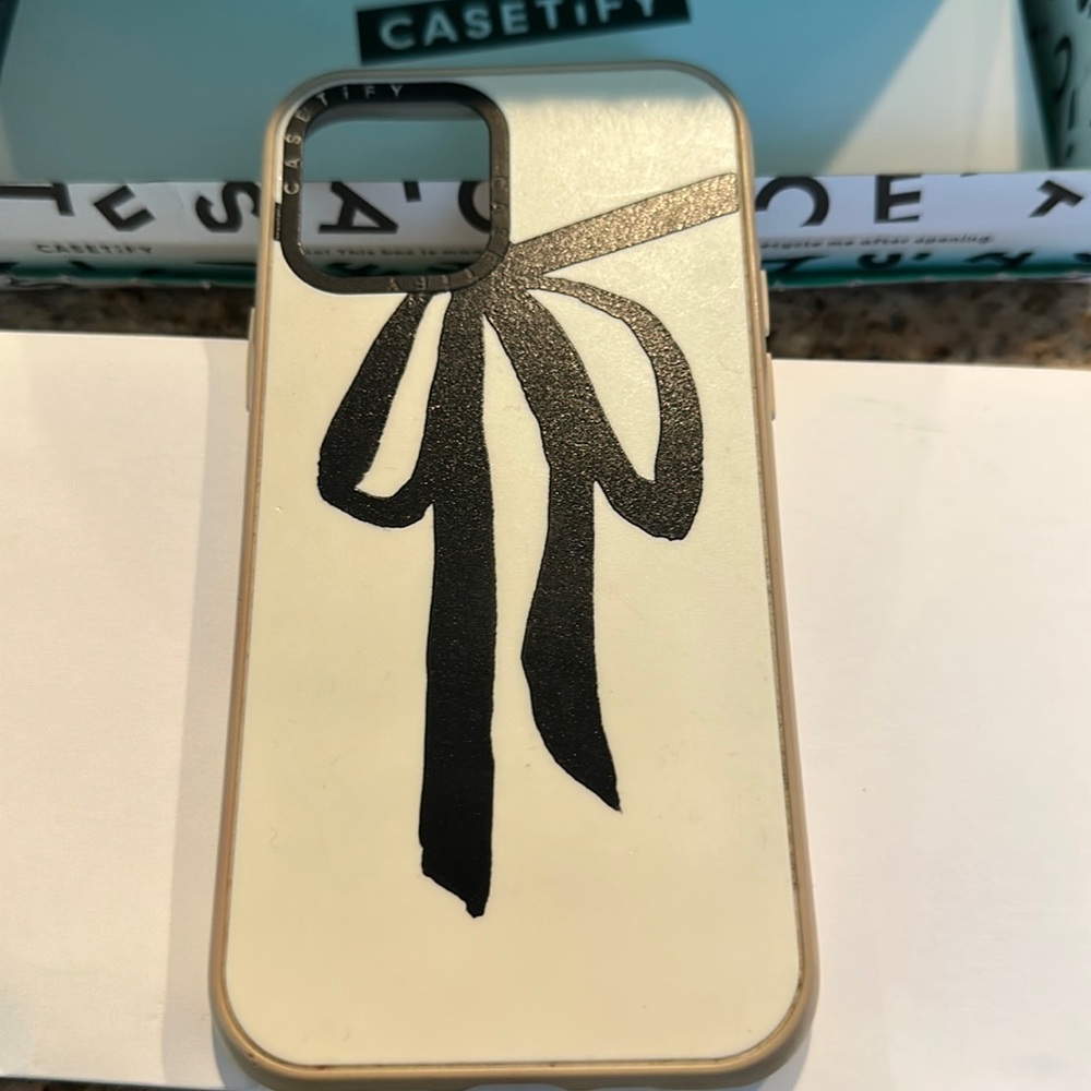 Casetify iPhone 12 cream with black bow case